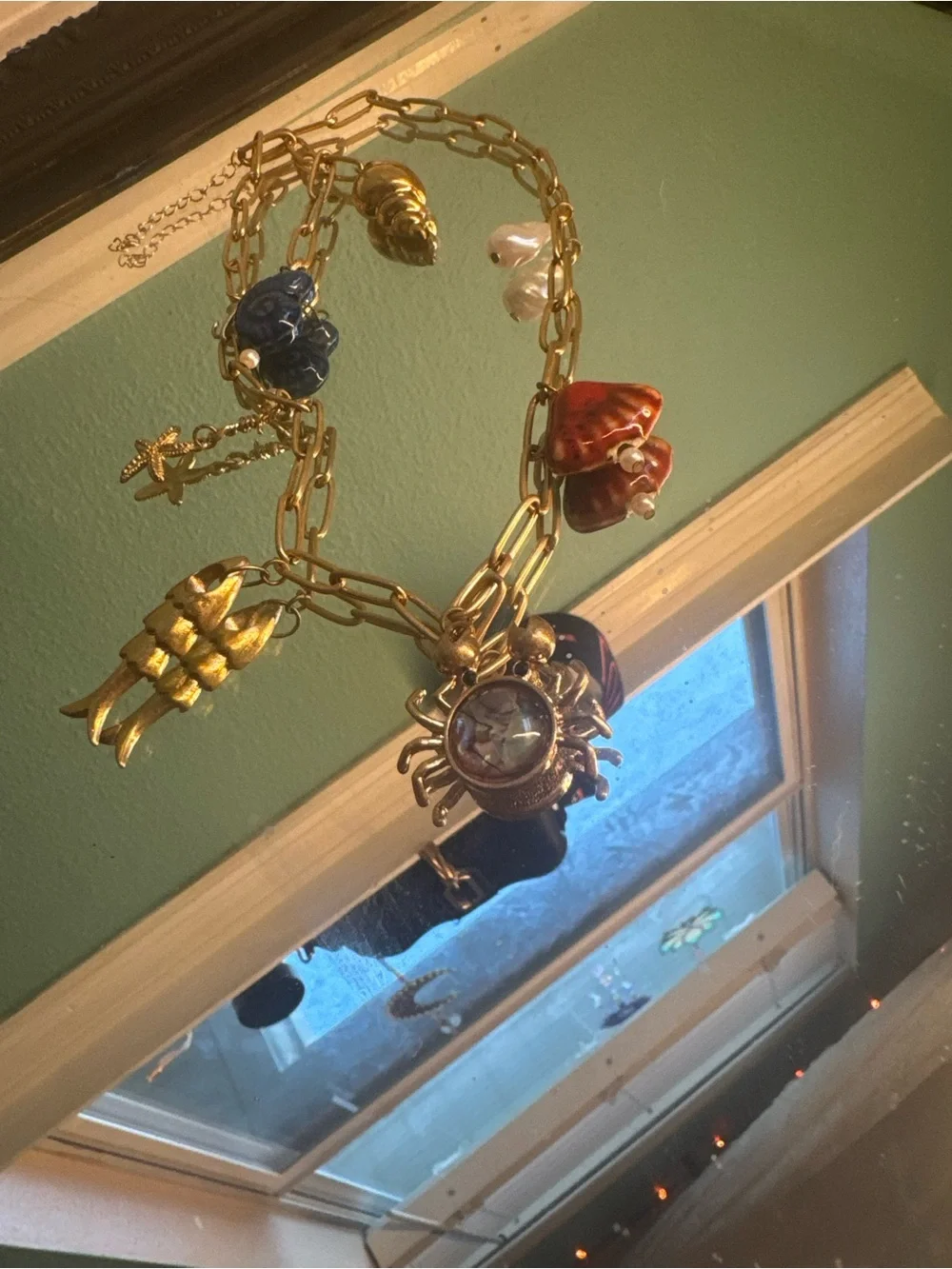 Anthropologie Gold-Tone Charm Necklace with Blue, Red and Pearl Accents